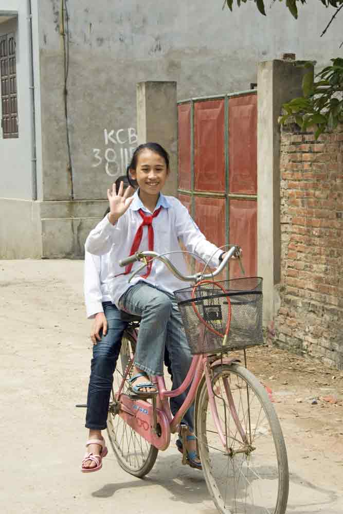 school girls on bikes-AsiaPhotoStock