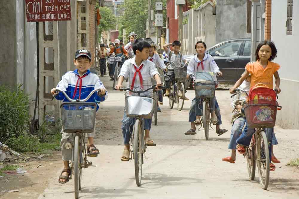 school children on bikes-AsiaPhotoStock