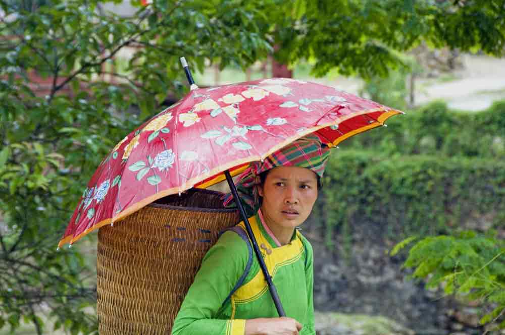 zay lady and umbrella-AsiaPhotoStock