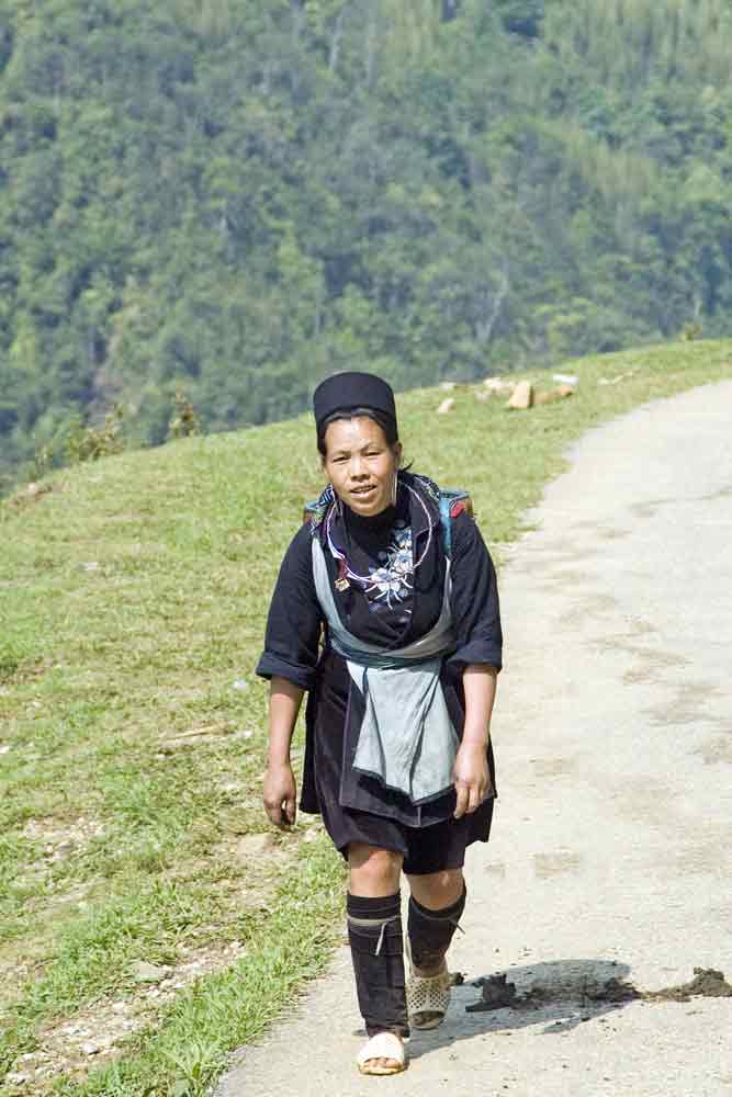 hmong lady walking-AsiaPhotoStock