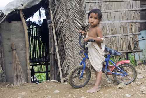 mangyan boy and bike-AsiaPhotoStock