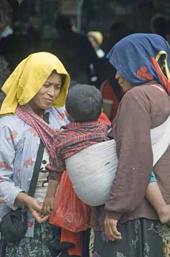 carrying child in sling-AsiaPhotoStock