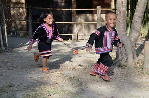 hmong kids playing chase-AsiaPhotoStock