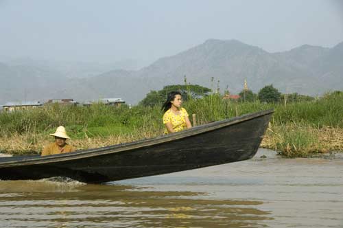 lady in a boat-AsiaPhotoStock