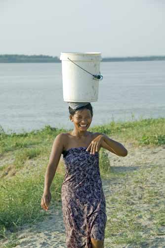 lady carrying bucket-AsiaPhotoStock