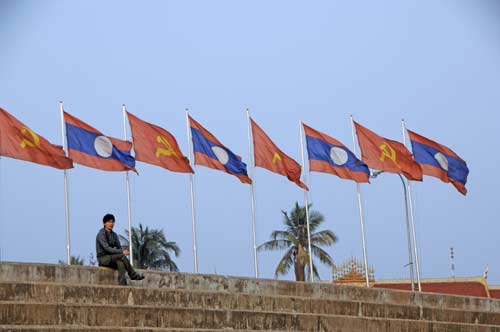 laos flags in vientiane-AsiaPhotoStock