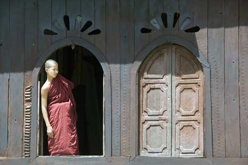 monk at window-AsiaPhotoStock