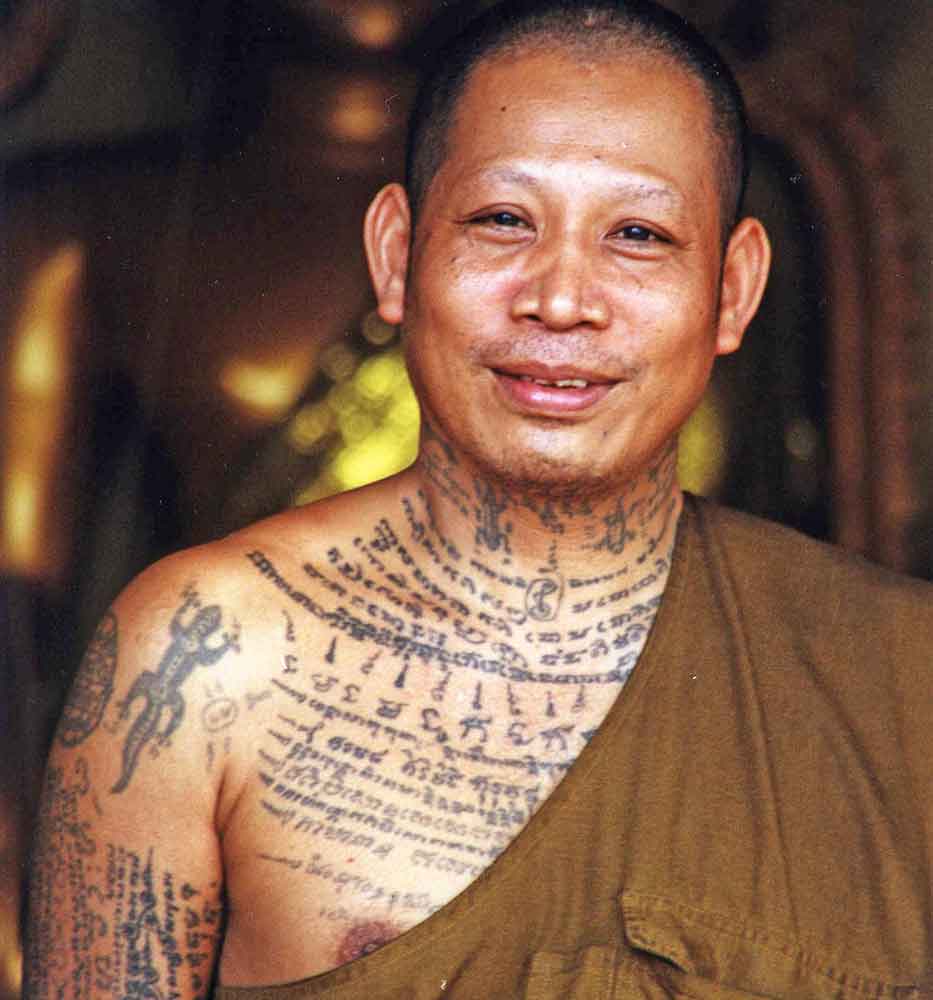 tattooed thai monk-AsiaPhotoStock