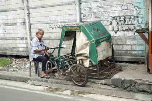 pedicab repair-AsiaPhotoStock