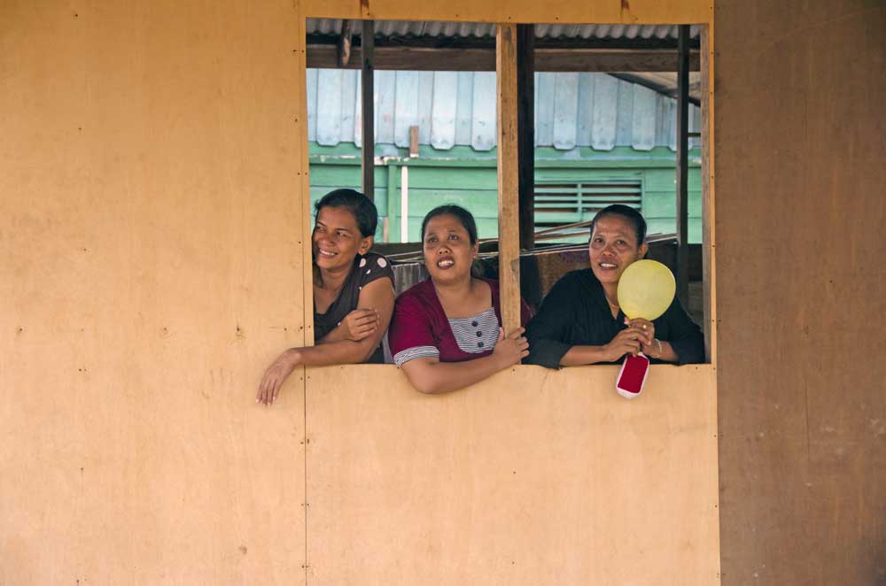 women at window-AsiaPhotoStock