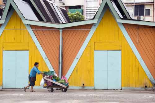 barrow by yellow wall-AsiaPhotoStock